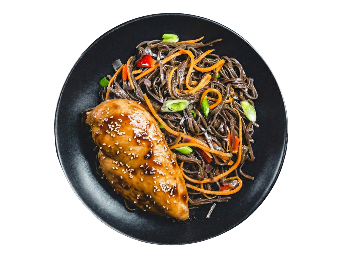 Chicken breast on soba noodles with vegetables in sesame sauce