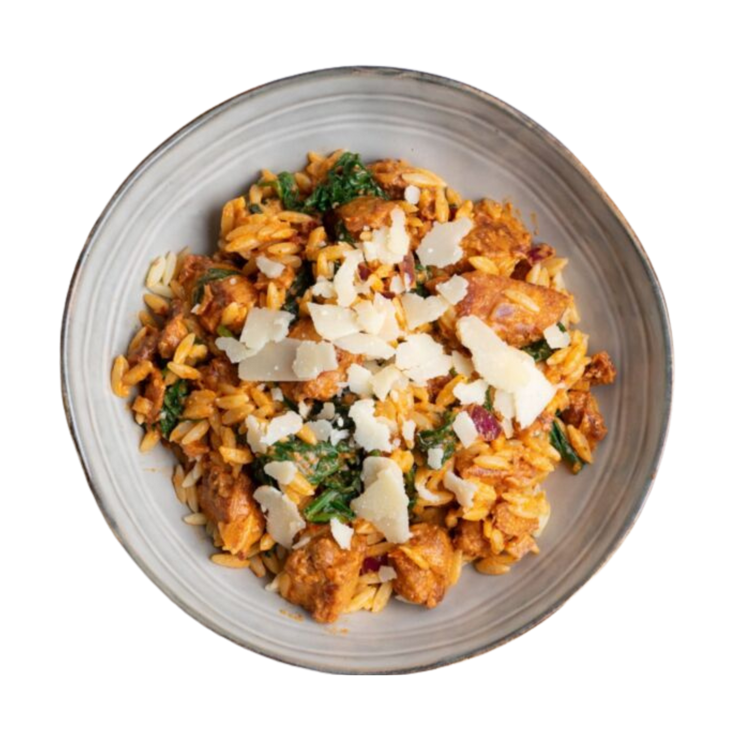 Chicken breast on orzo with vegetables and pesto