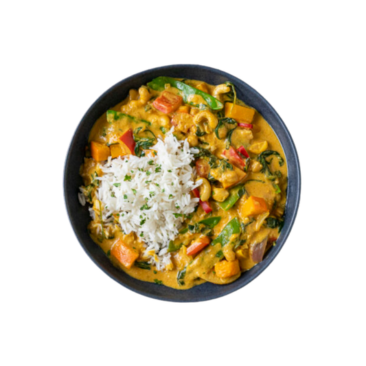 Pumpkin curry with spinach, tomatoes and sprouts with rice