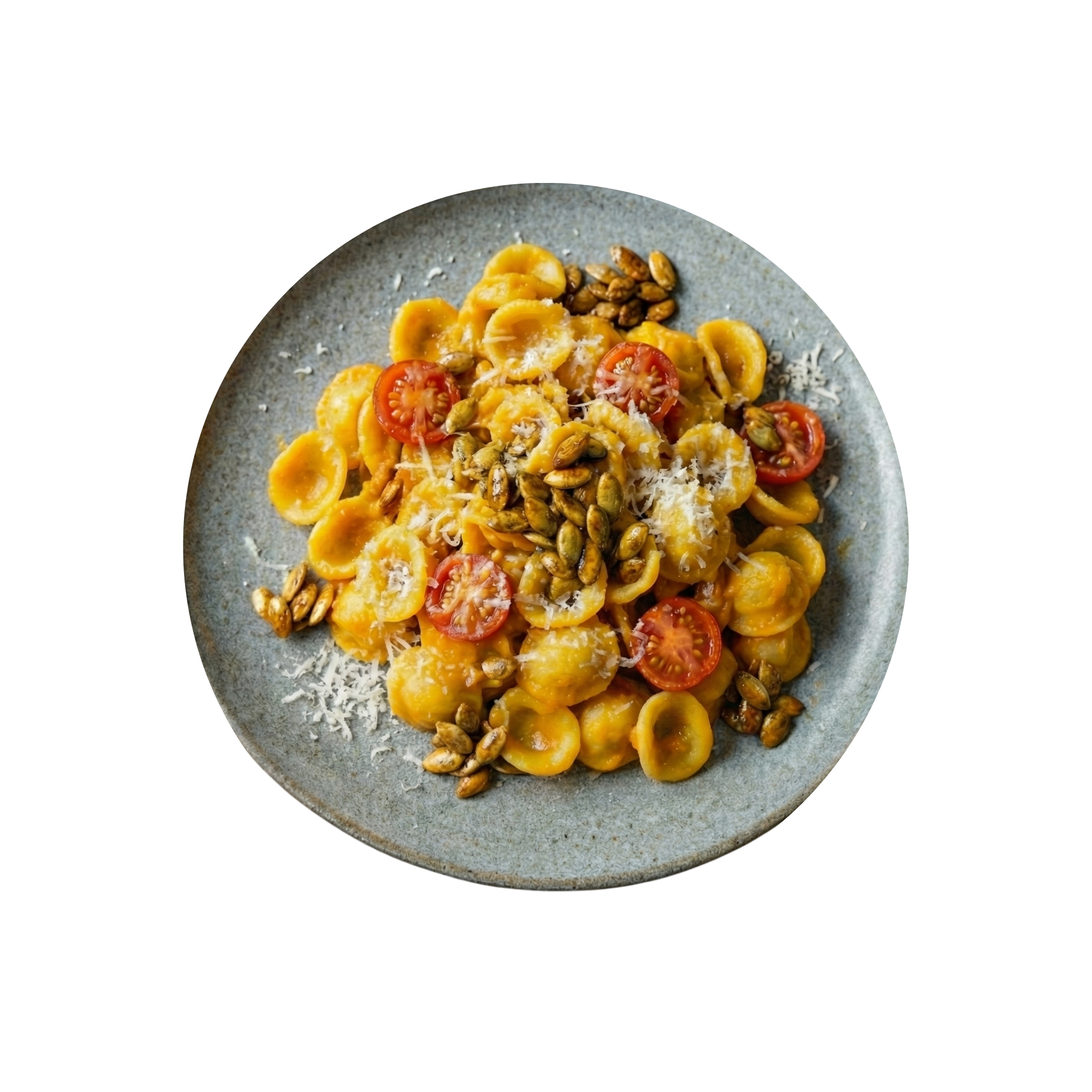 Orecchiette with pumpkin sauce, tomatoes and caramelized seeds