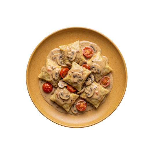 Teigtaschen mit Tomatenfüllung in Pilzrahmsauce mit Kirschtomaten